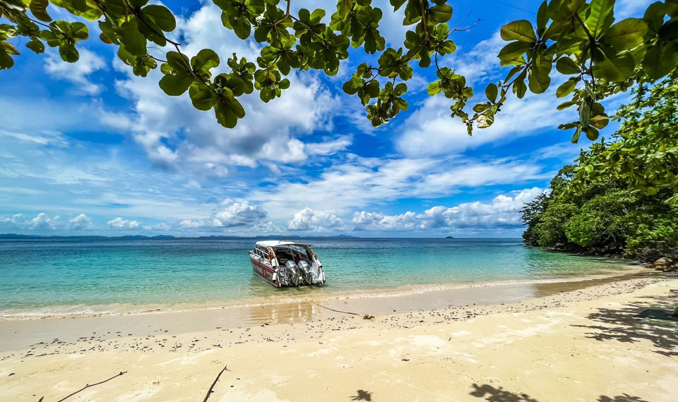 boat docked at bamboo island